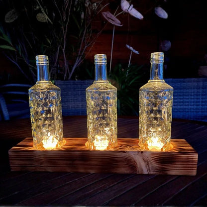 Bougeoir triple en bouteilles recyclées avec socle en bois