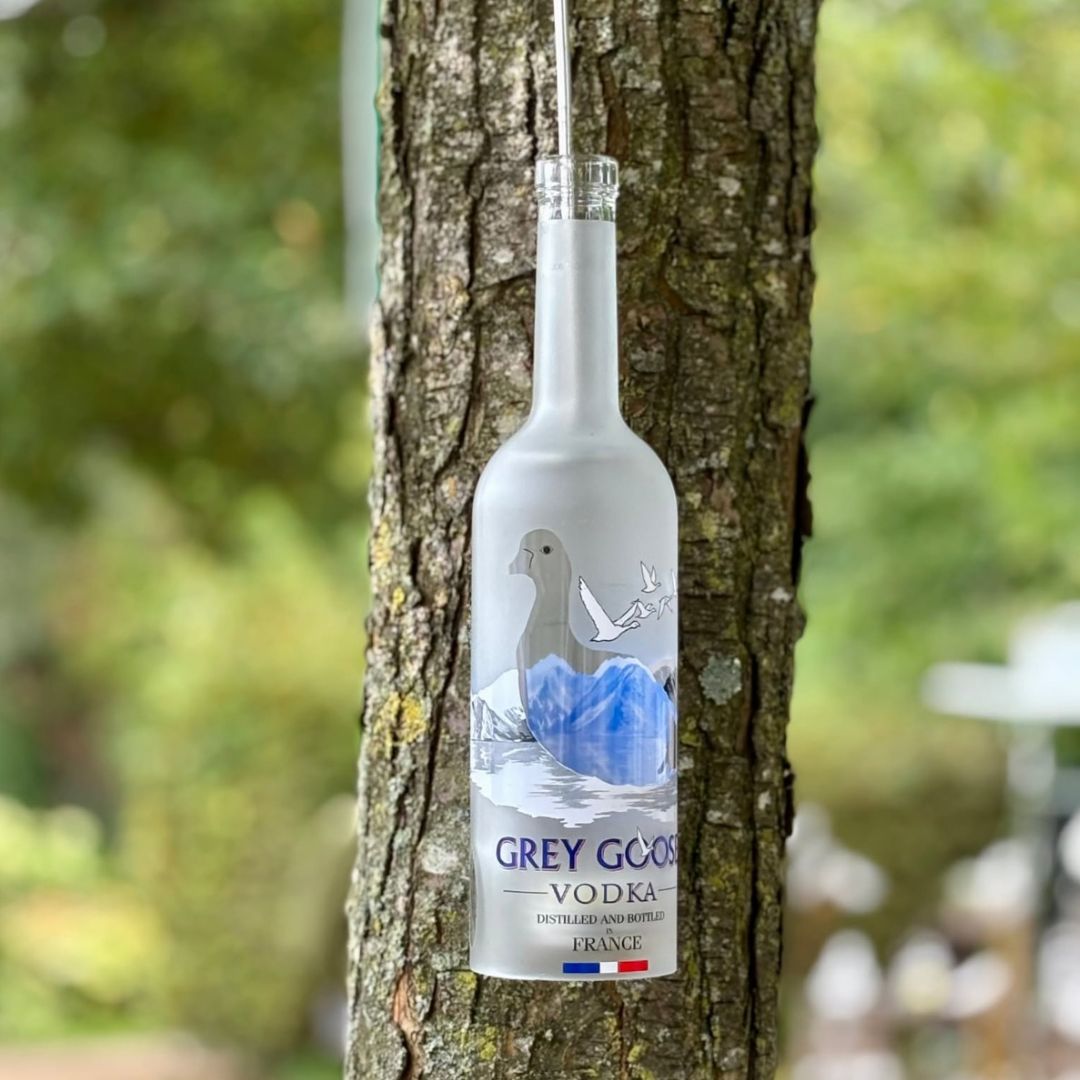 Hanging lamp made from a recycled vodka bottle